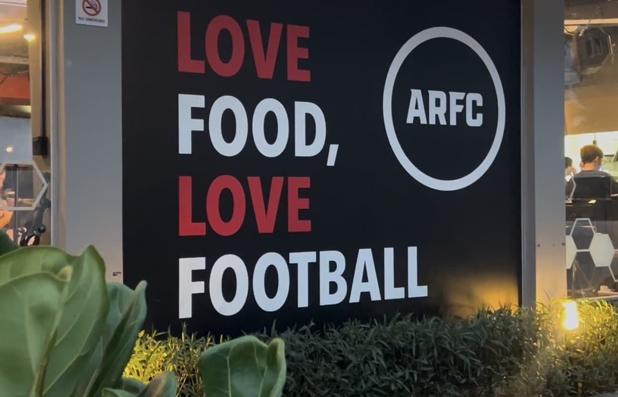 ARFC Woodleigh sign reading Love Food, Love Football outside the restaurant at PUB Recreation Club