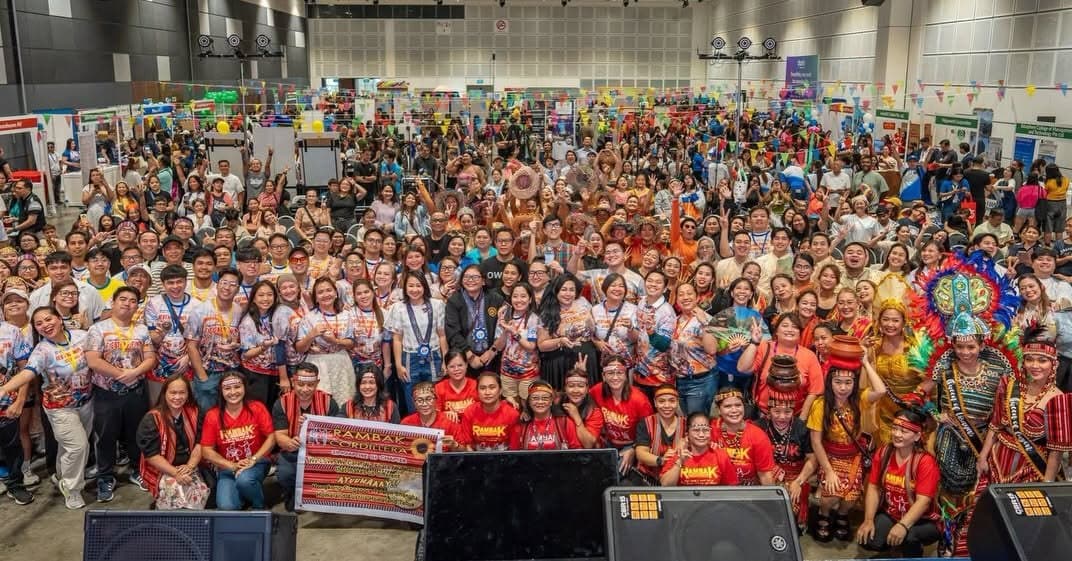 The Fiestang Pinoy 2026 committee, volunteers and cultural performers gathered on stage at Suntec Hall 406 in Singapore for a group photo