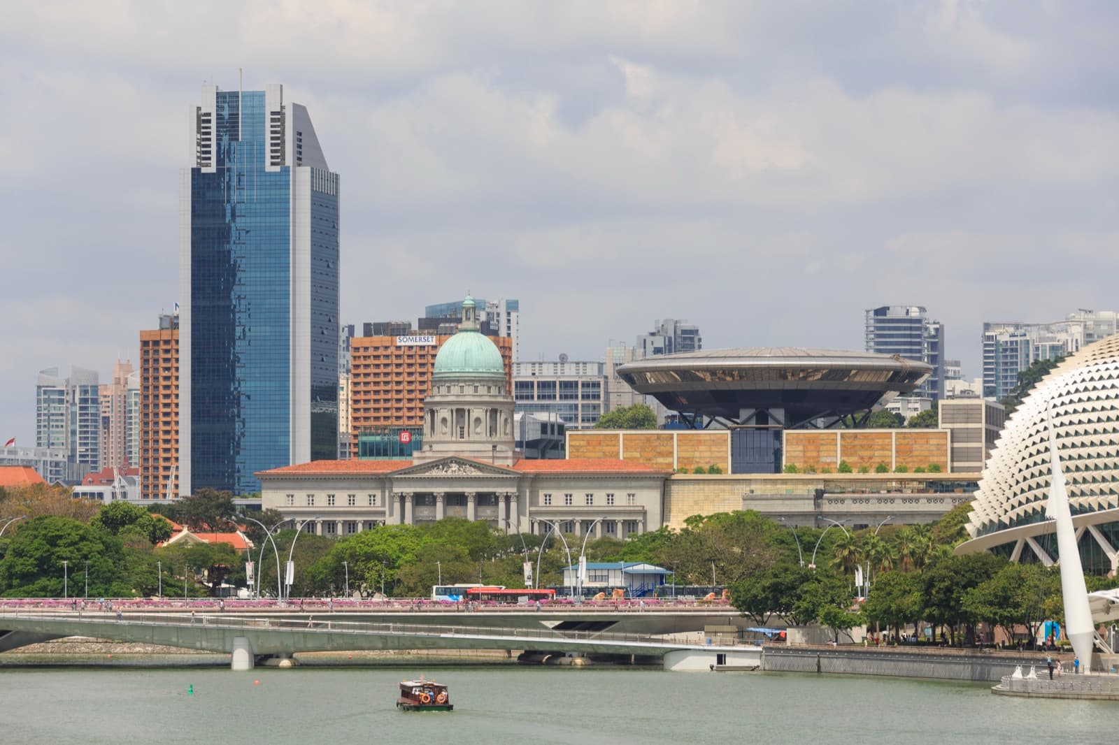A young man walking into a courthouse in Singapore.