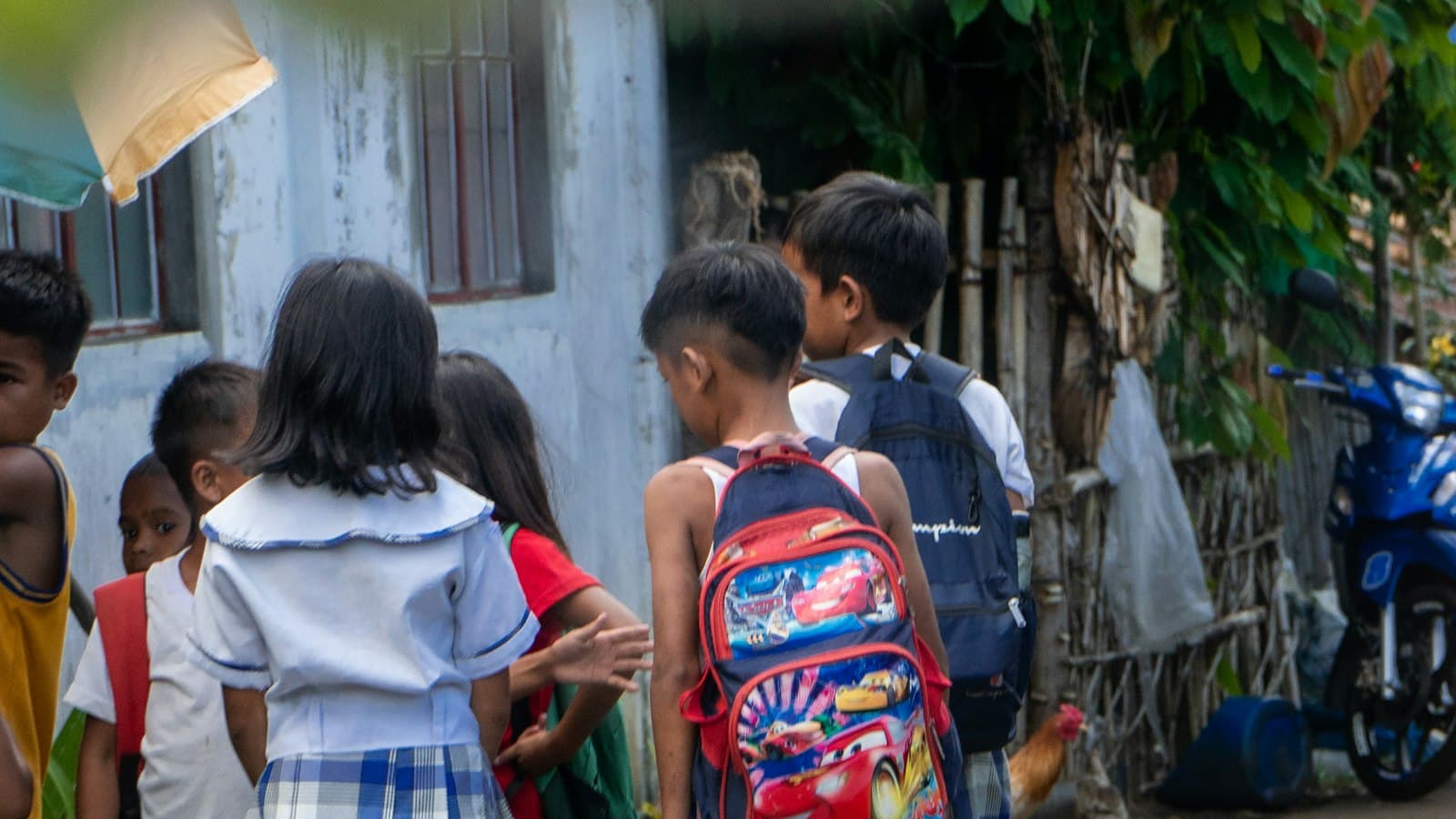 Filipino schoolchildren walking to class in Tigaon, Camarines Sur