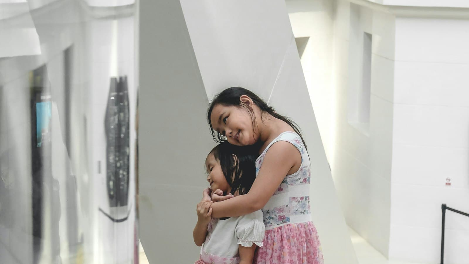 A Filipina mother and her daughter hugging, Manila