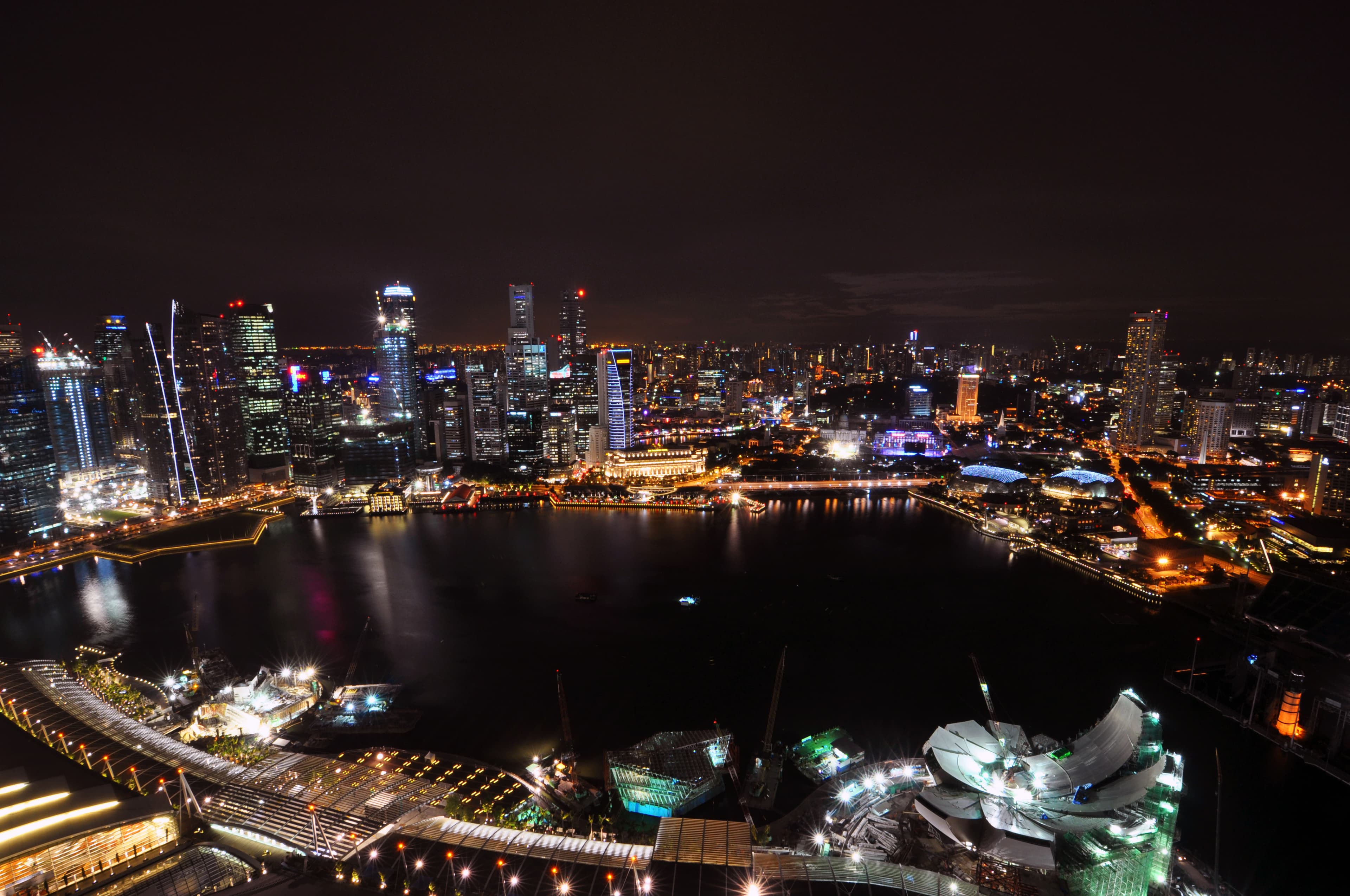 Night view of Marina Bay Sands SkyPark and the Singapore Central Business District skyline.
