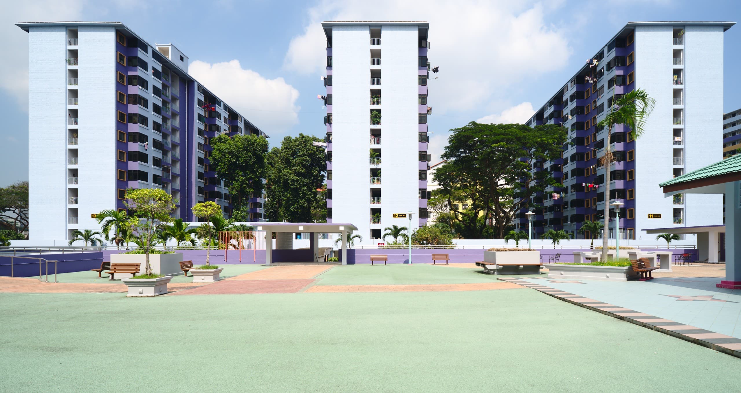 A cluster of HDB public housing blocks in Singapore, the kind of estate where many Filipinos rent a room.