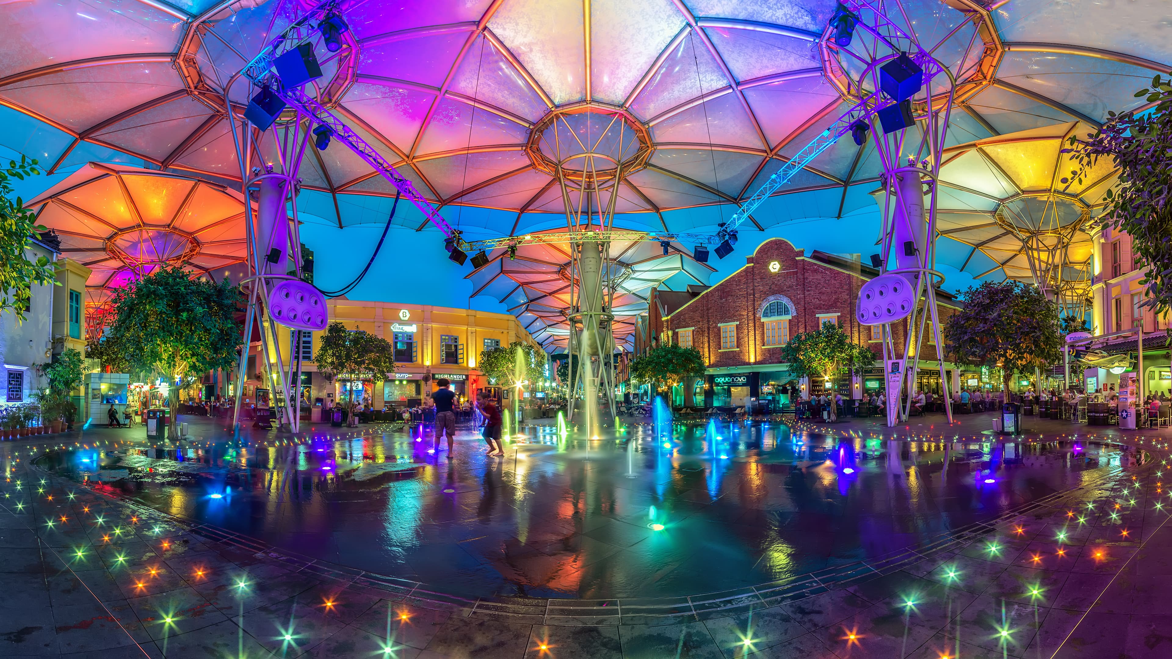 The Clarke Quay waterfront in Singapore lit up in the evening